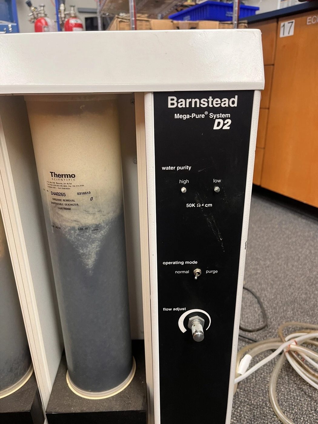 A Barnstead Mega-Pure System D2 water purification still standing on a laboratory bench