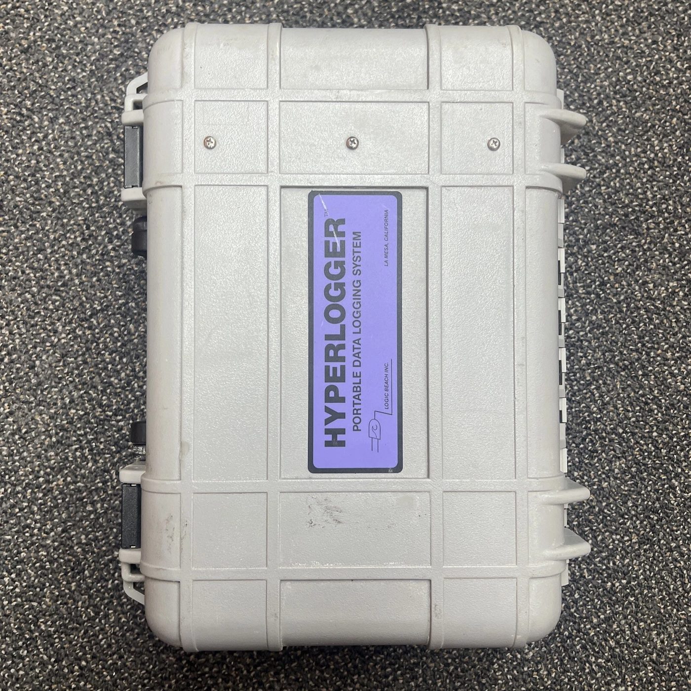 A Hyperlogger portable data logging system in a grey ruggedised carry case