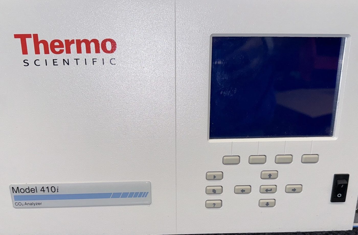 A Thermo Scientific Model 410i CO2 analyzer, its front panel and keypad clean, display dark